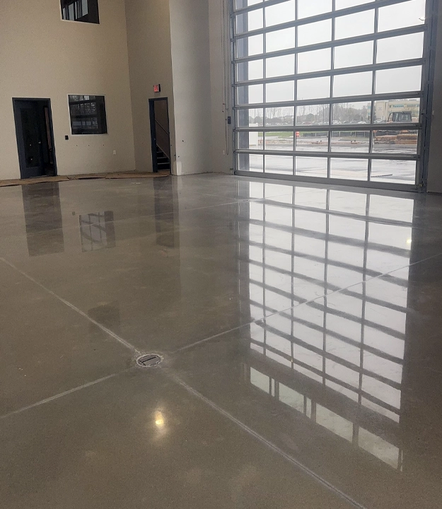 Polished concrete in warehouse with garage door
